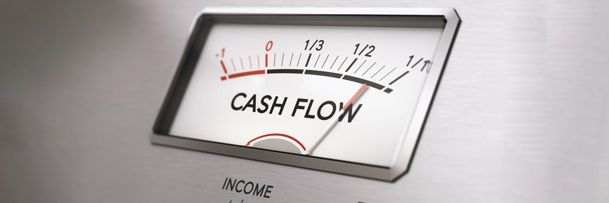 Man turning income knob to increase cash flow amount. Concept of good management of liquidities in a company. Composite image between a hand photography and a 3D background.